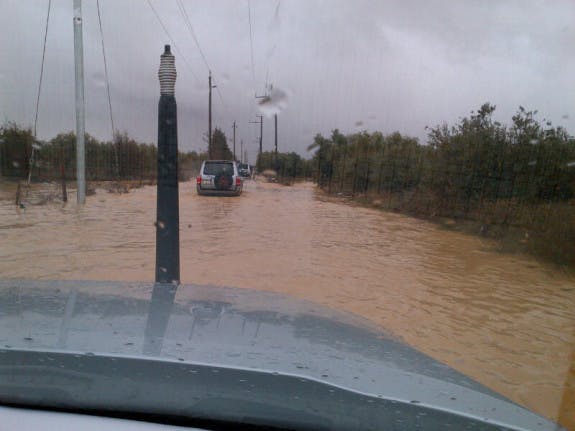 Flooded-entrance-to-Zaatari-575x431.jpg